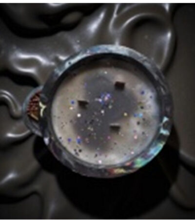 Fragrance Galaxy luxury crystal candle with cosmic sparkle design and glowing flame