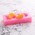 Mini fruit silicone mold with strawberry, orange, and berry shapes for DIY soap and dessert crafts